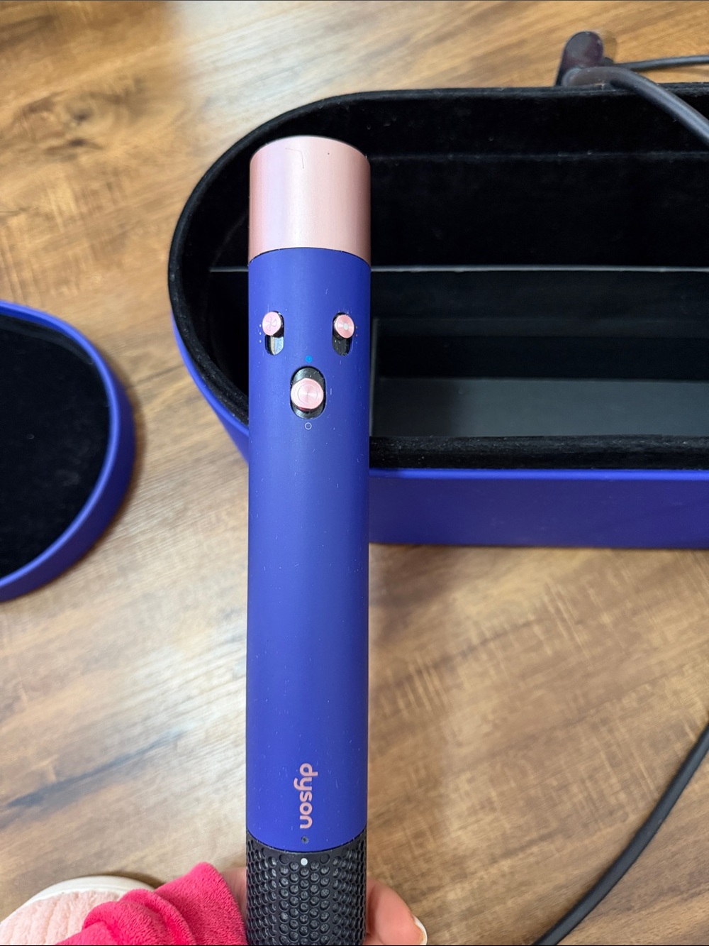 Dyson styling wand in blue with pink accents